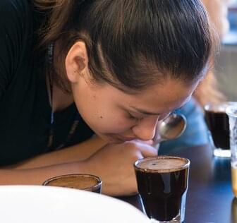woman smelling coffee