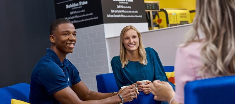 young professionals chatting and having coffee