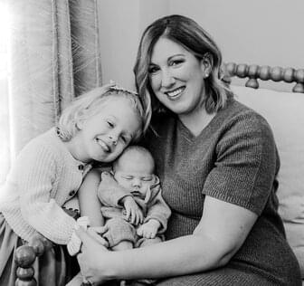 mother and two children posing for picture