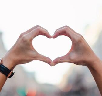 two hands together forming a heart