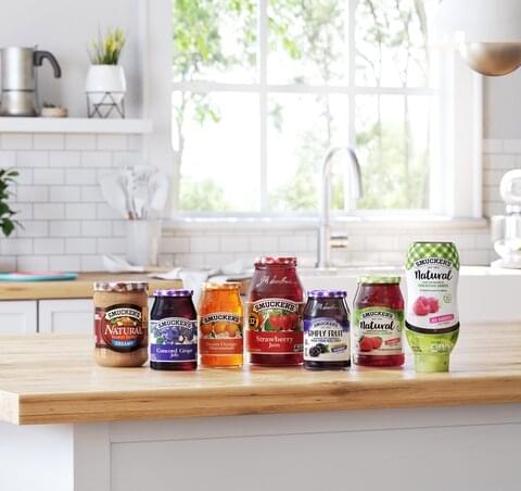 smuckers fruits spreads sitting on countertop